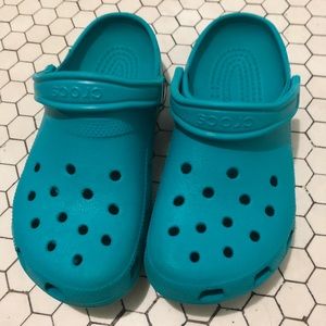 Turquoise Crocs (women’s size 8 men’s size 6)